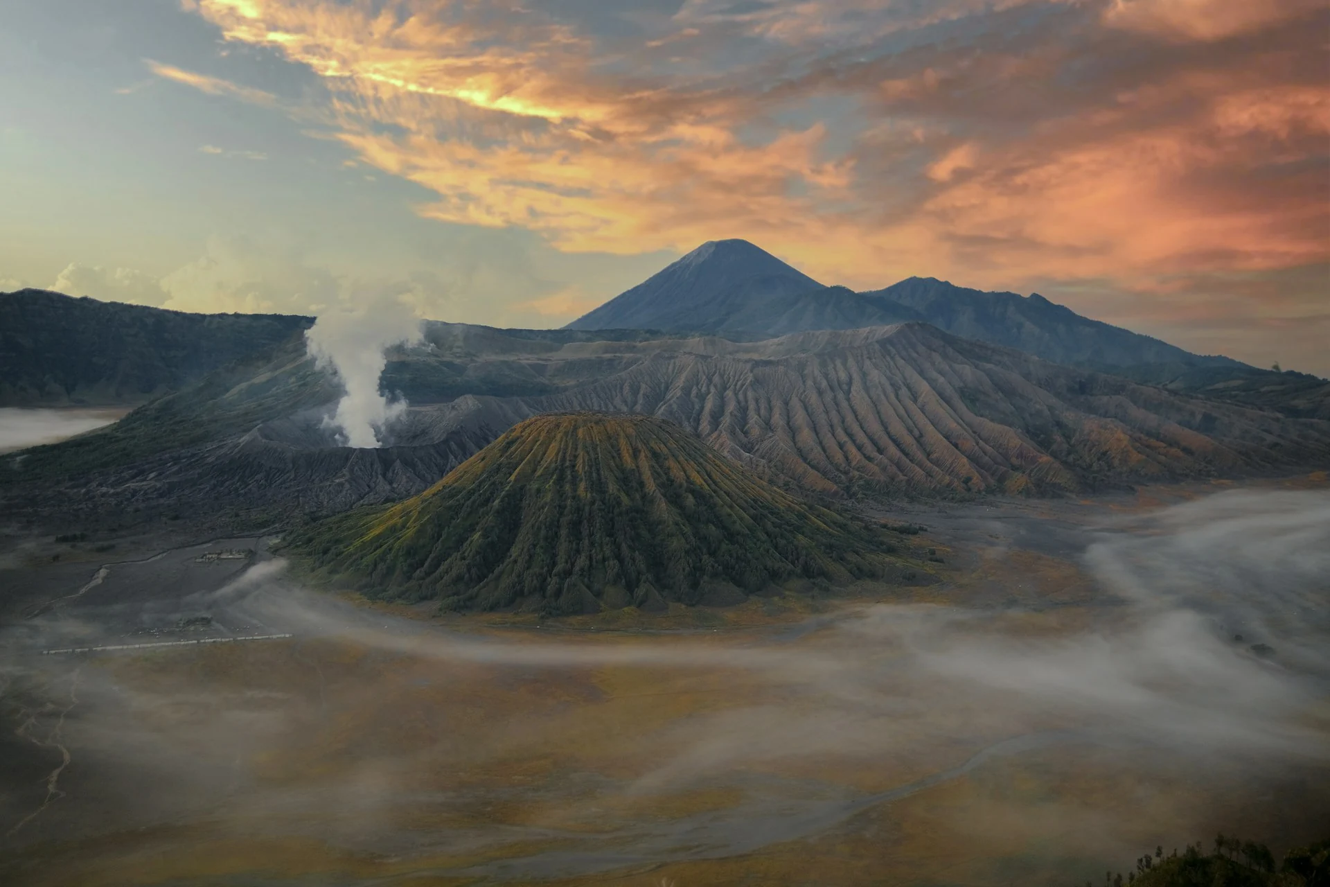 Mount Bromo rising through clouds in East Java