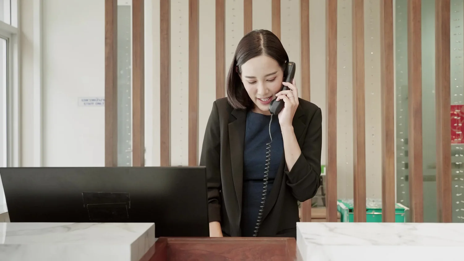 Personal concierge arranging a request by telephone