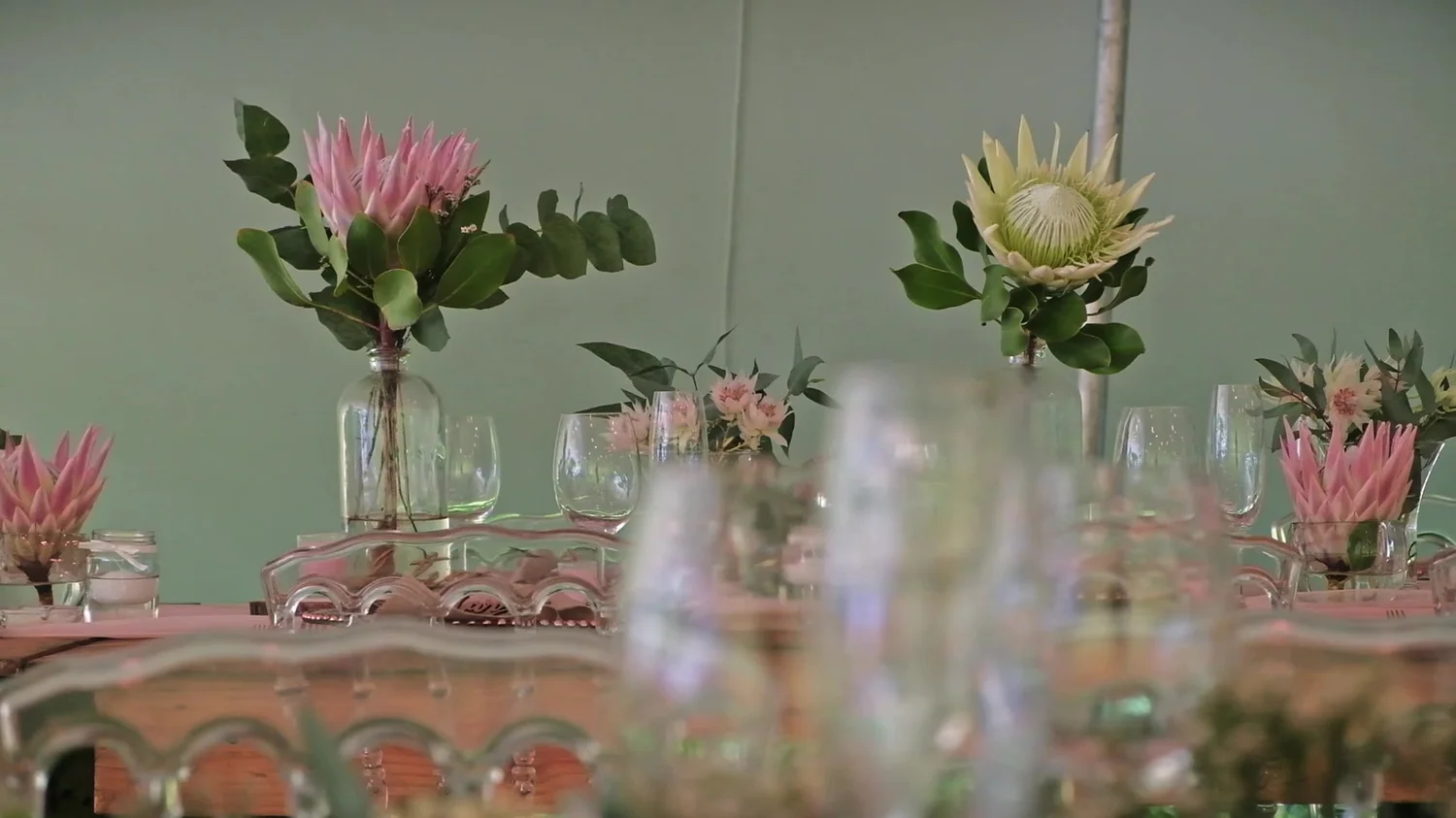 Flowers and place settings at a private dinner