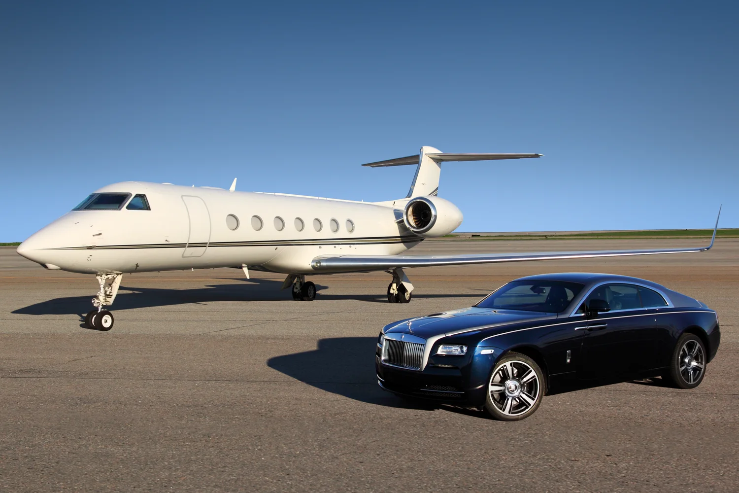 A private aircraft and chauffeur vehicle on the apron