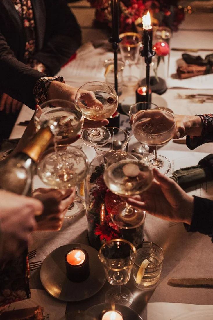 Guests raising glasses at a private gathering