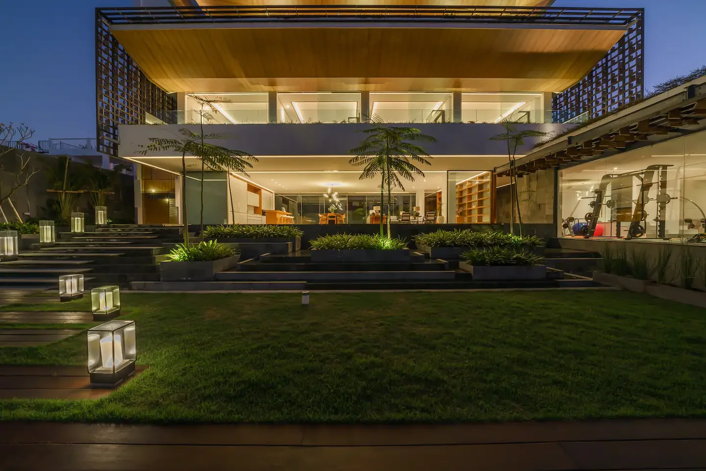 A contemporary residence illuminated at dusk