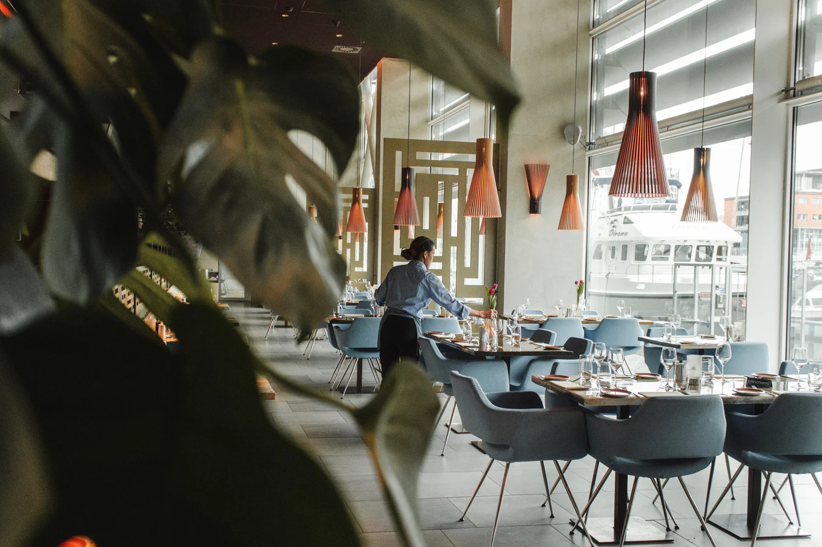 Guests dining in a light-filled restaurant